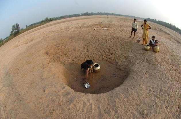 EFFECTIVE MANAGEMENT: Water policy must not be driven by corporations and global finance. In this photograph, villagers looking for water on the Maneeru riverbed near Singarayakonda in Prakasam district, Andhra Pradesh. Photo: Kommuri Srinivas